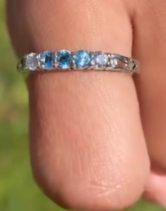 Silver band set with blue and white stones