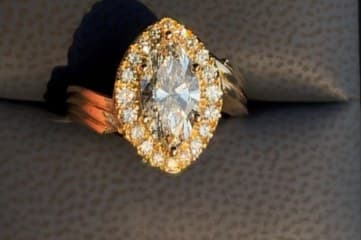 Marquise diamond halo ring in yellow gold