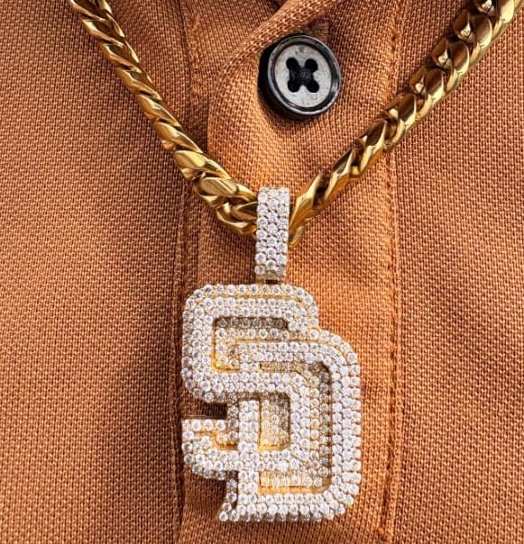 Iced SD Padres pendant on a gold Cuban link